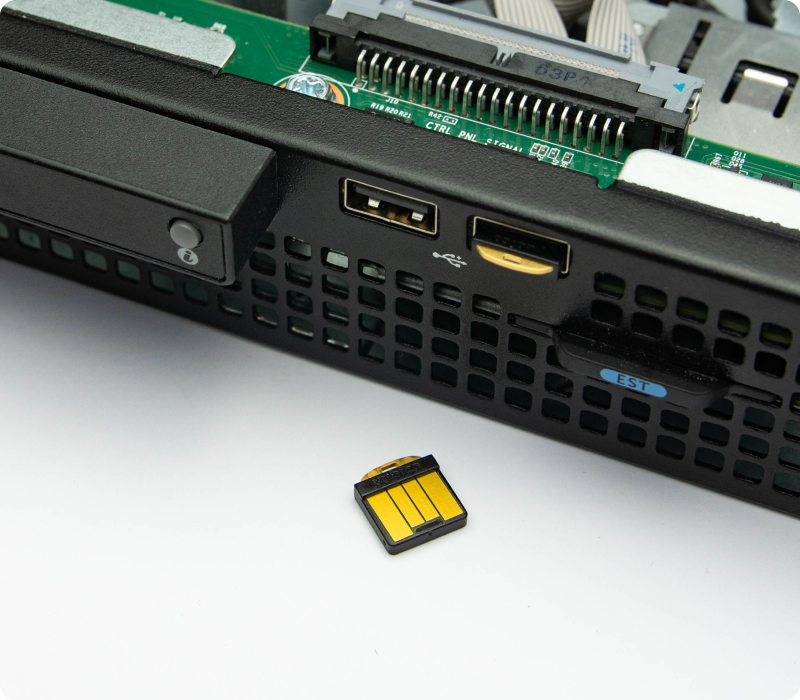 A YubiHSM 2 module beside the front USB ports of a rack server